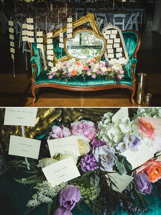 Wedding seating chart display with flowers and mirrors