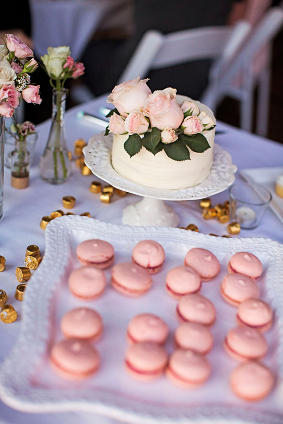 french macarons and rose topped mini cake
