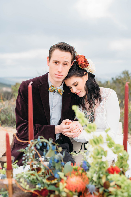 Romantic wedding couple in pose holding hands outdoors