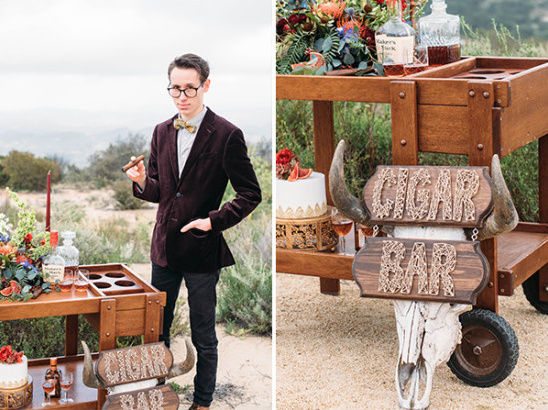 Man smoking cigar at outdoor rustic cigar bar cart
