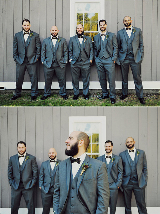dark grey groomsmen in three piece suits and bow ties
