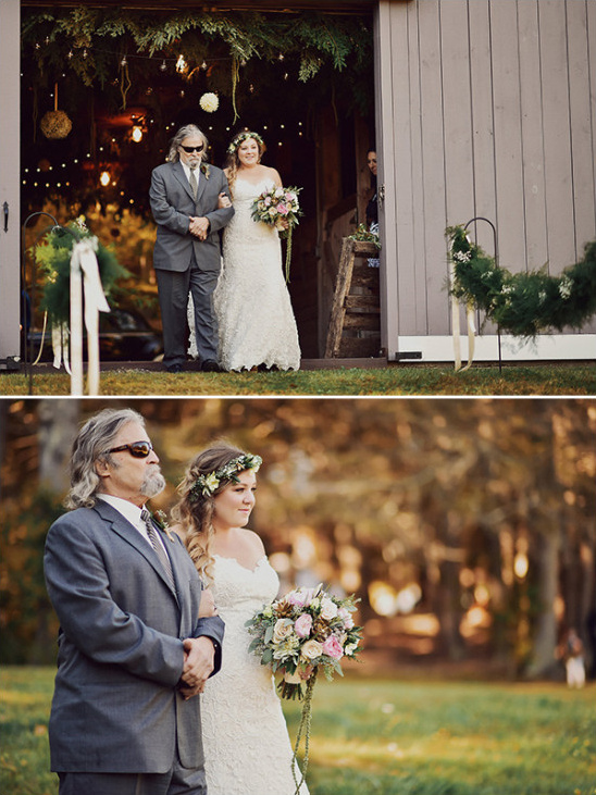 Bride and father walk down aisle at rustic wedding