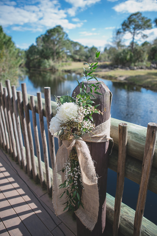 loose and organic styled flower decor wrapped in burlap