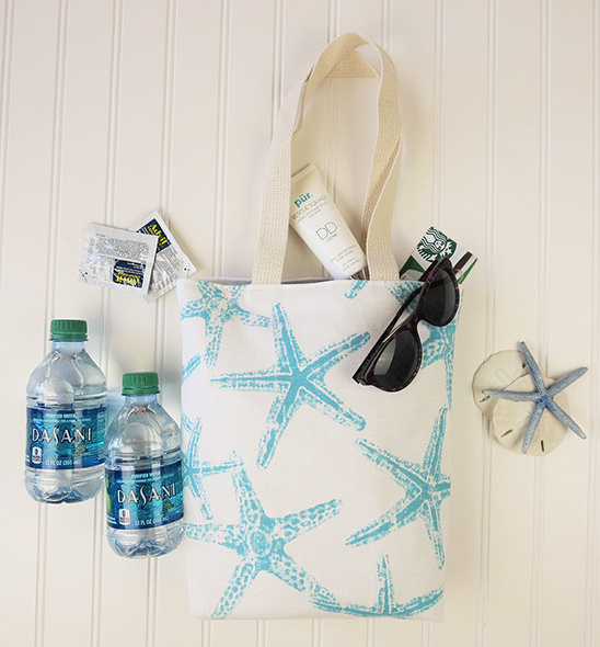Starfish beach bag with water sunscreen and sunglasses