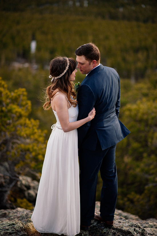 Loving couple embraces on their wedding day outdoors