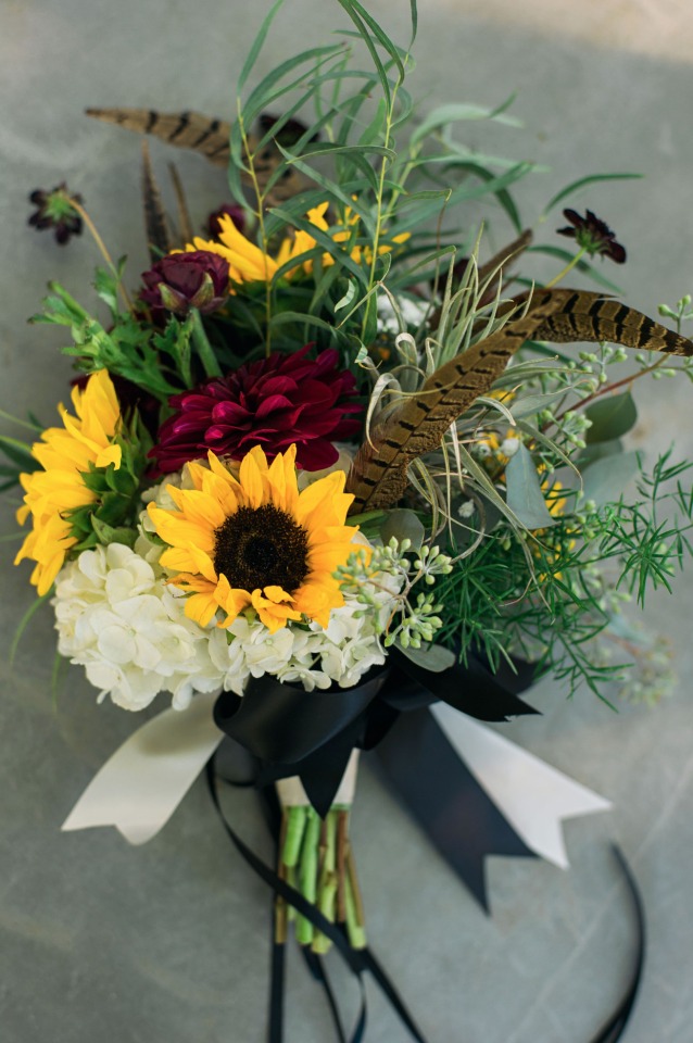 feather and sunflower wedding bouquet