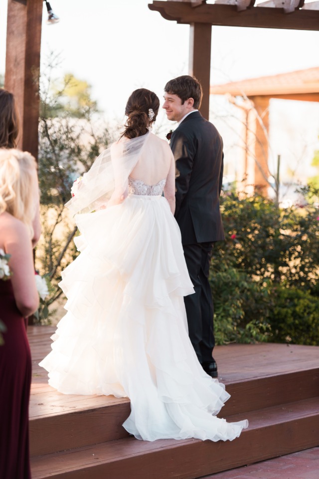 Bride and groom on their wedding day facing forward