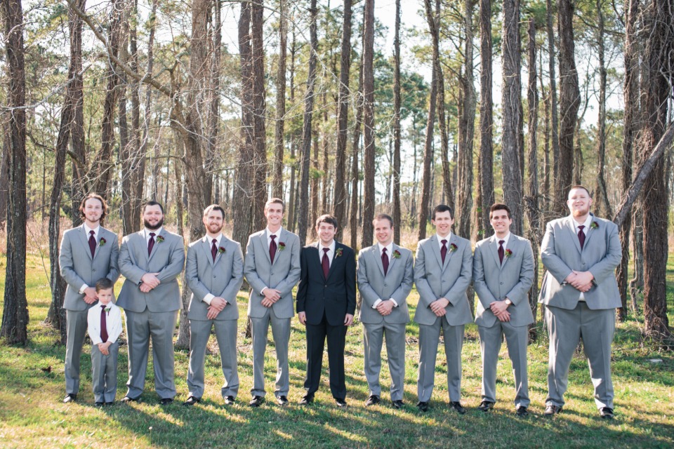 Groom and groomsmen in grey, black and maroon