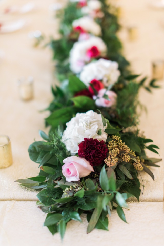 Elegant floral centerpiece with roses and greenery