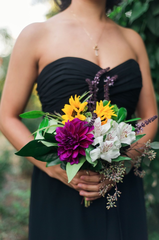 black bridesmaid dress with brightly colored bouquet