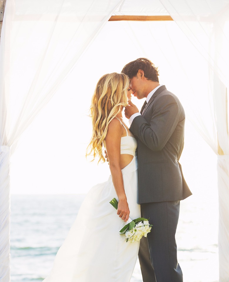 Beach wedding with a loving bride and groom