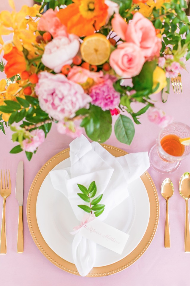 charming wedding place setting in gold pink and white