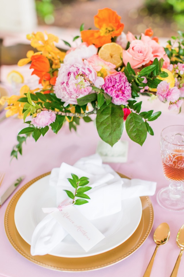 pink and gold wedding table decor with citrus inspired centerpiece