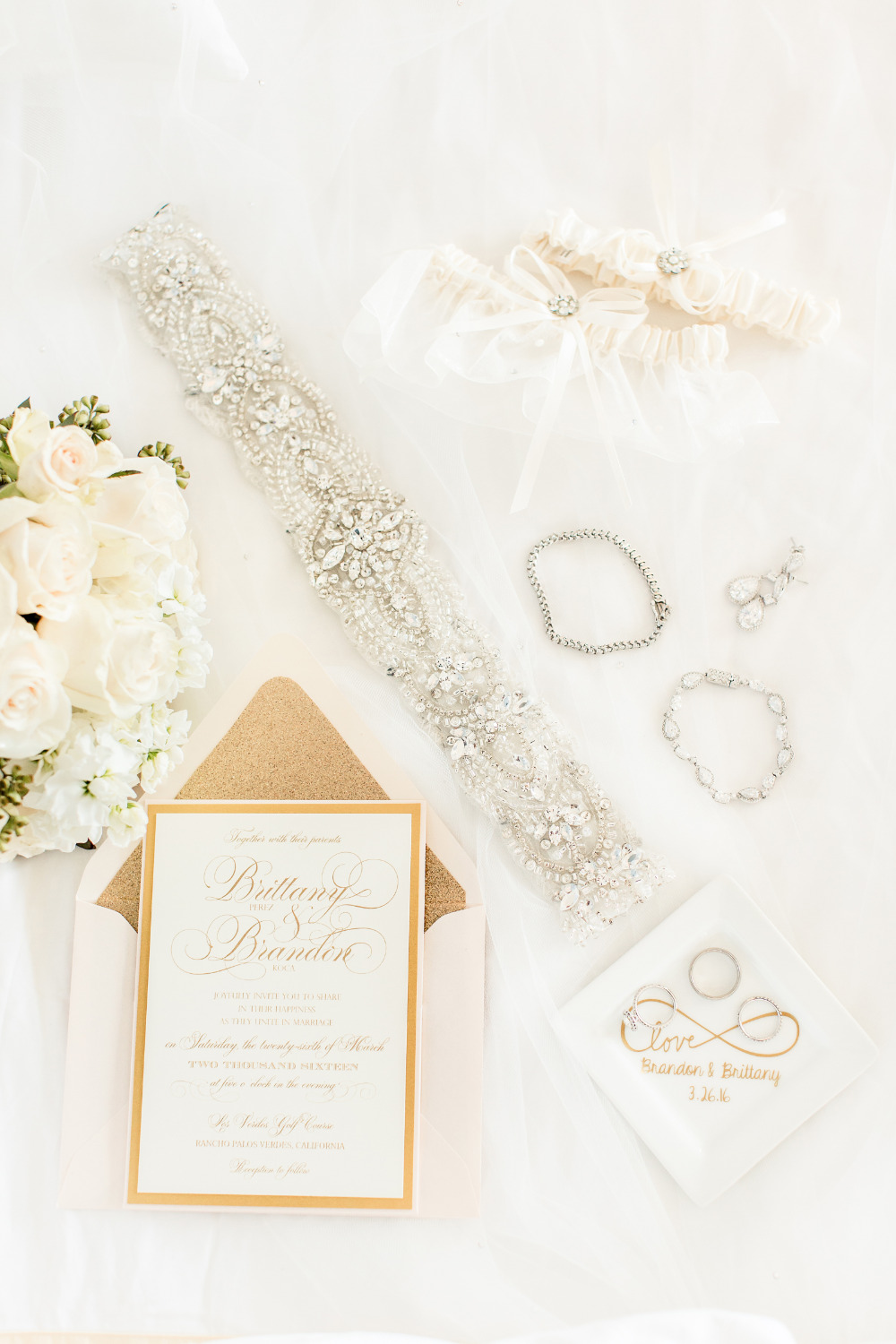 wedding accessories and gold invites