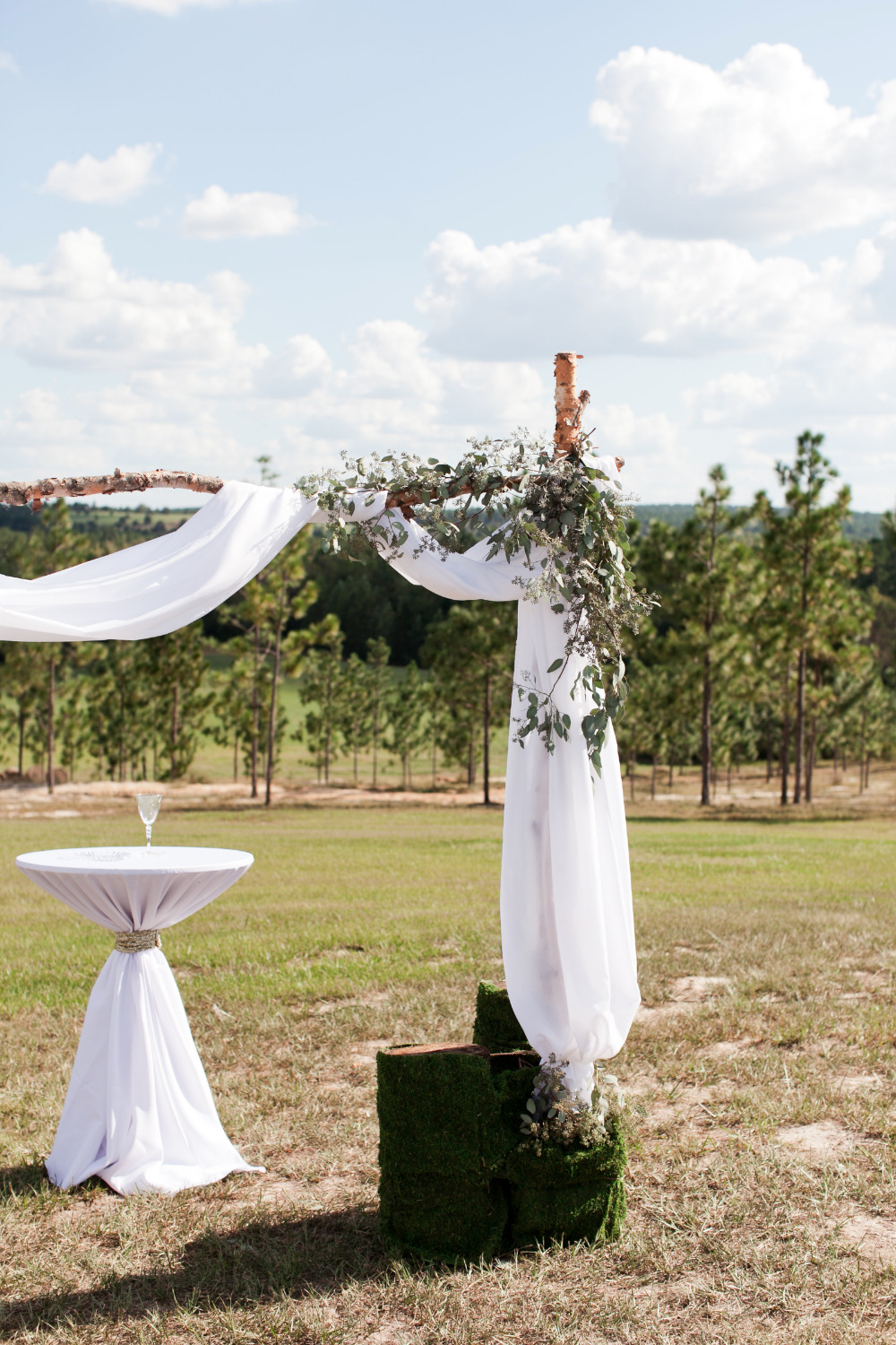 draped wedding arbor with tulle and garlands