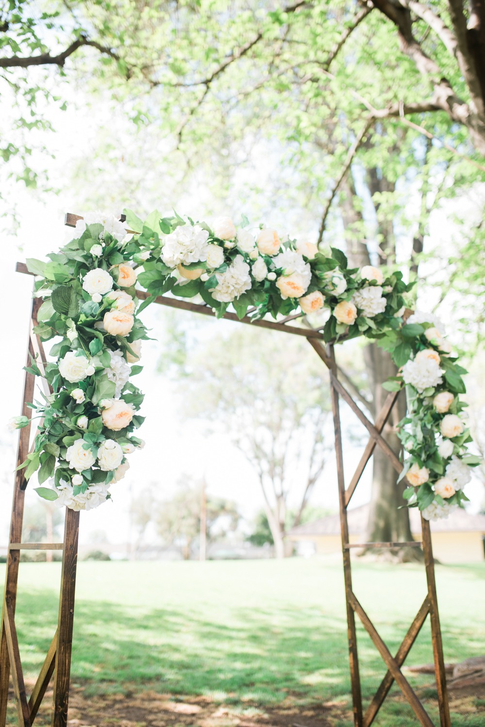 Chic ceremony arch with florals