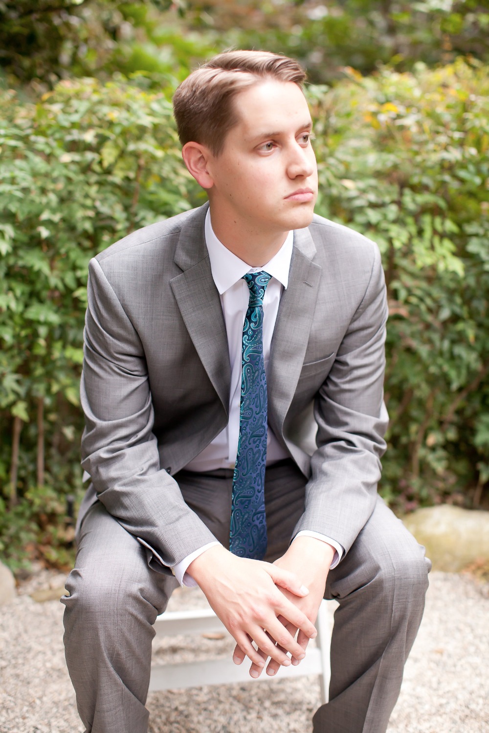 groom in light grey suit and ocean blue tie
