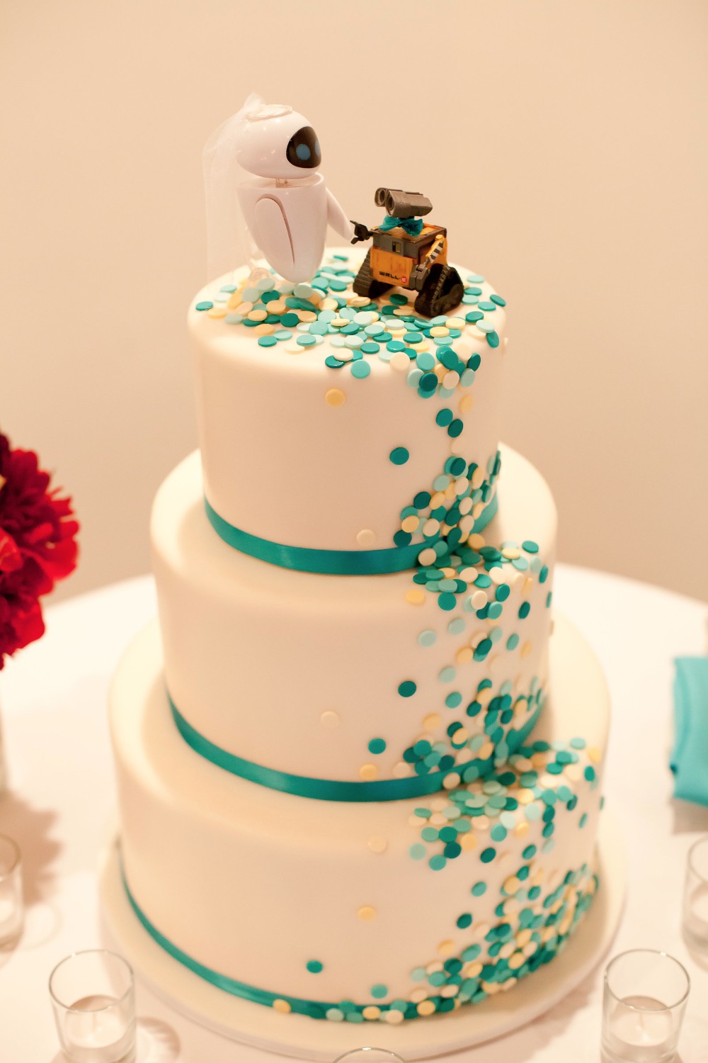 cute confetti wedding cake with Wall-E themed cake topper