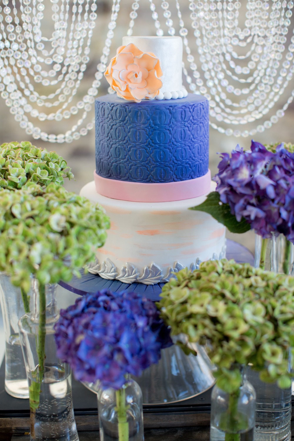 Pink blue and peach wedding cake
