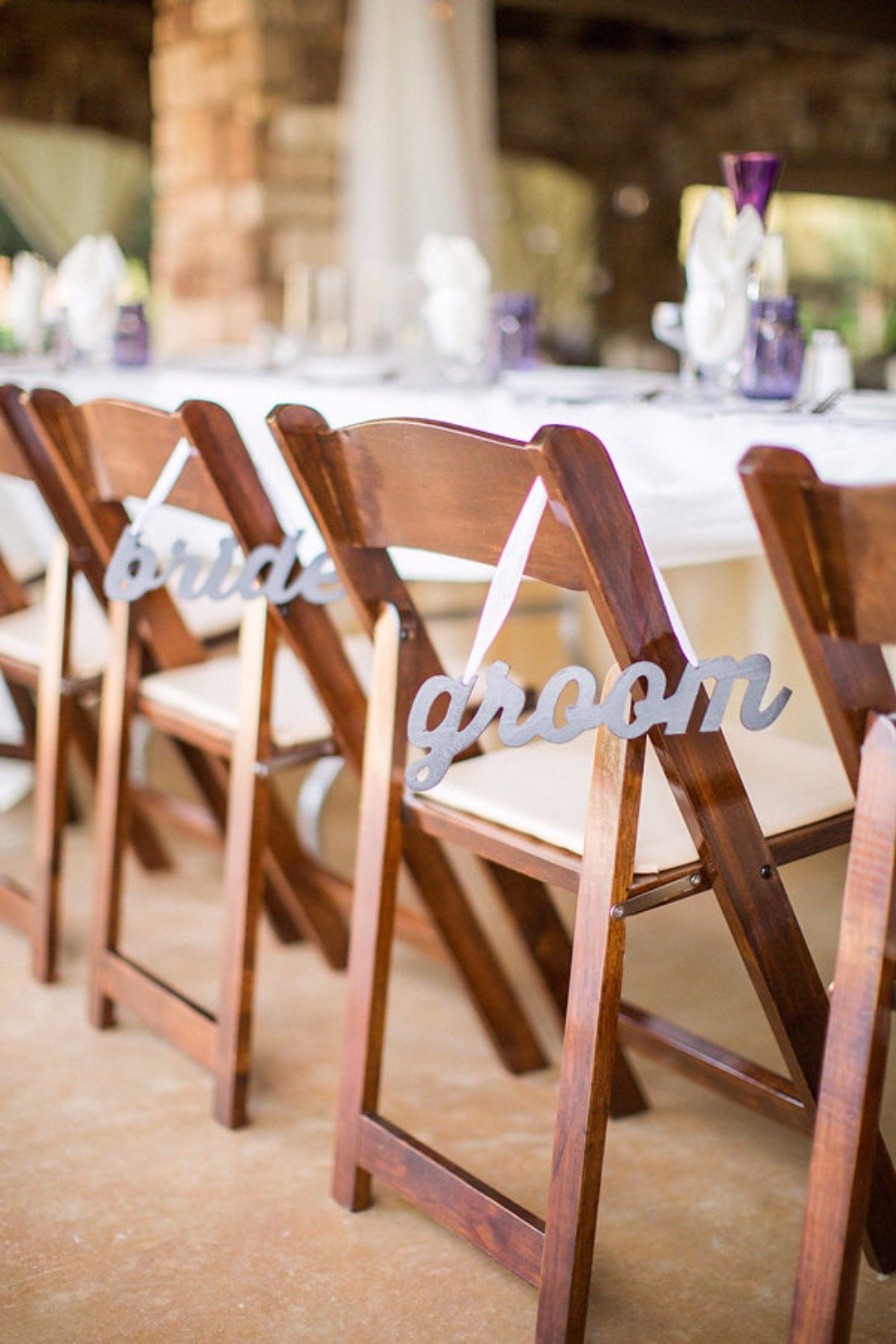 Bride and groom chair signs