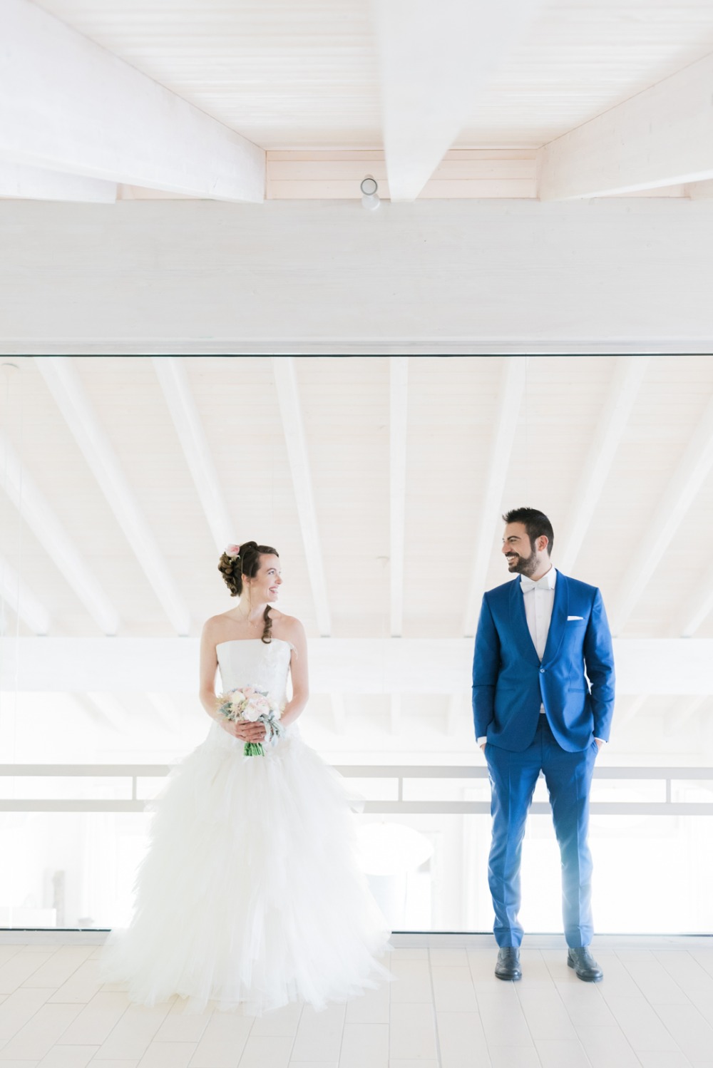 royal blue groom suit and classic bride in wedding gown