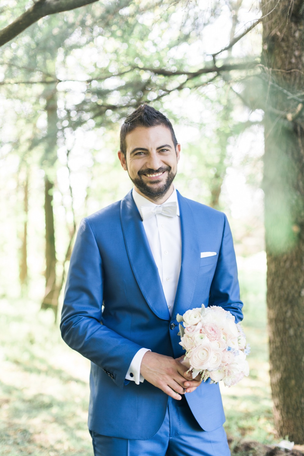 groom in bright blue