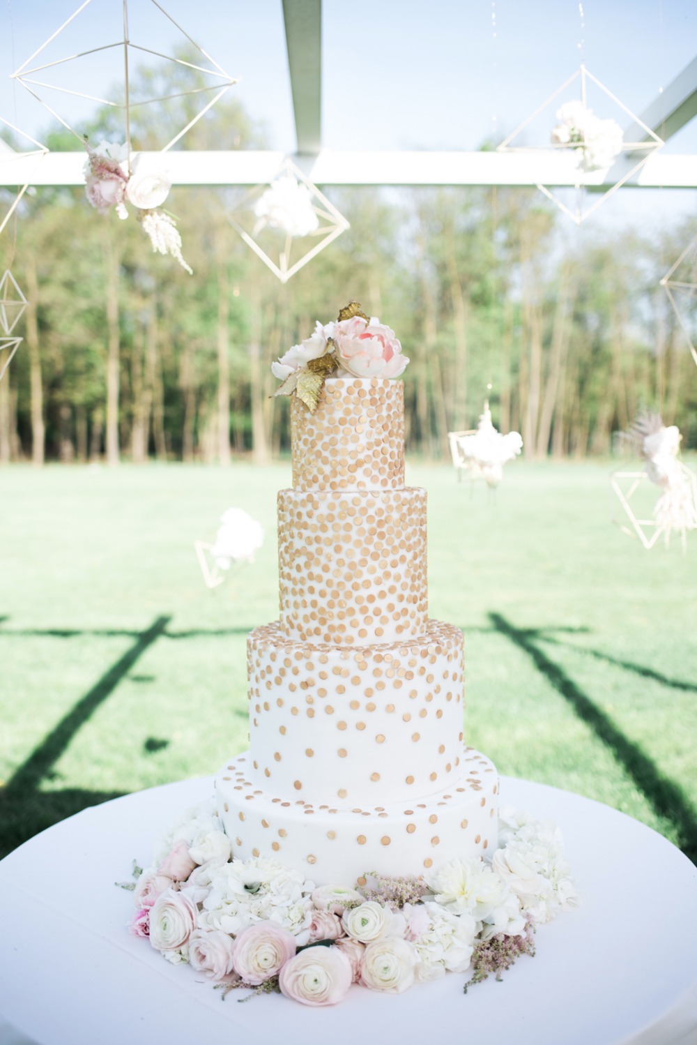 modern gold and white wedding cake