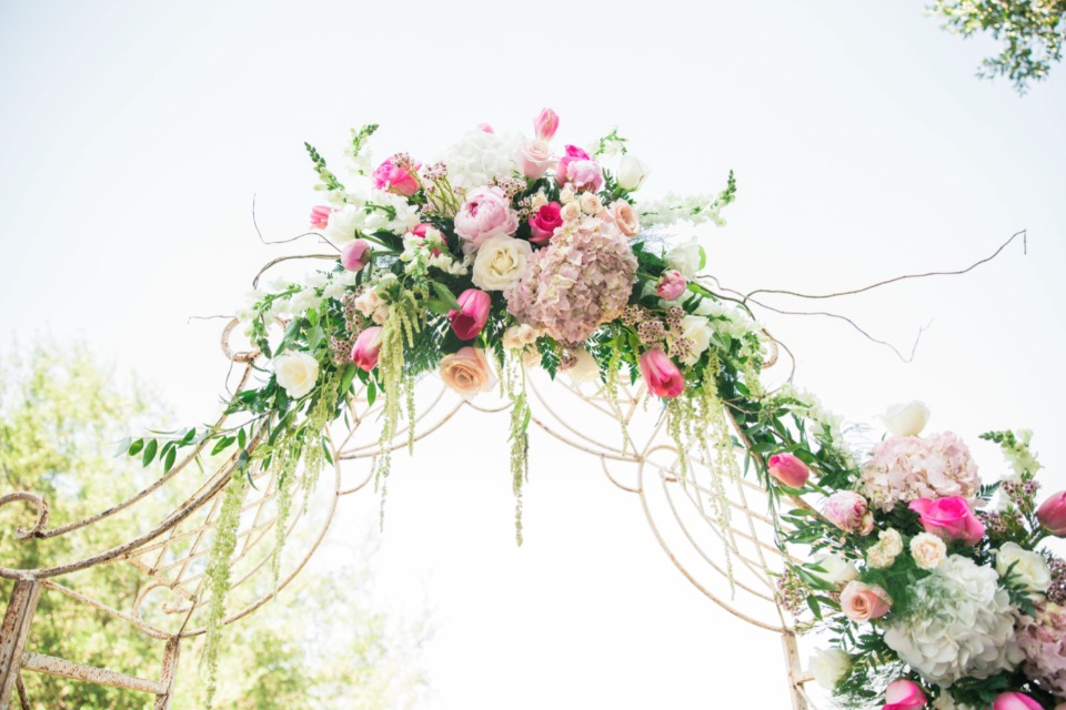 flowering wedding arch with florals by Dee Dee's Boutique & More