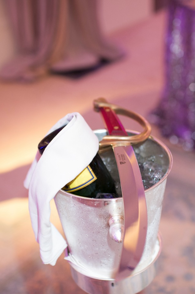 Celebration champagne bottle in ice bucket with saber