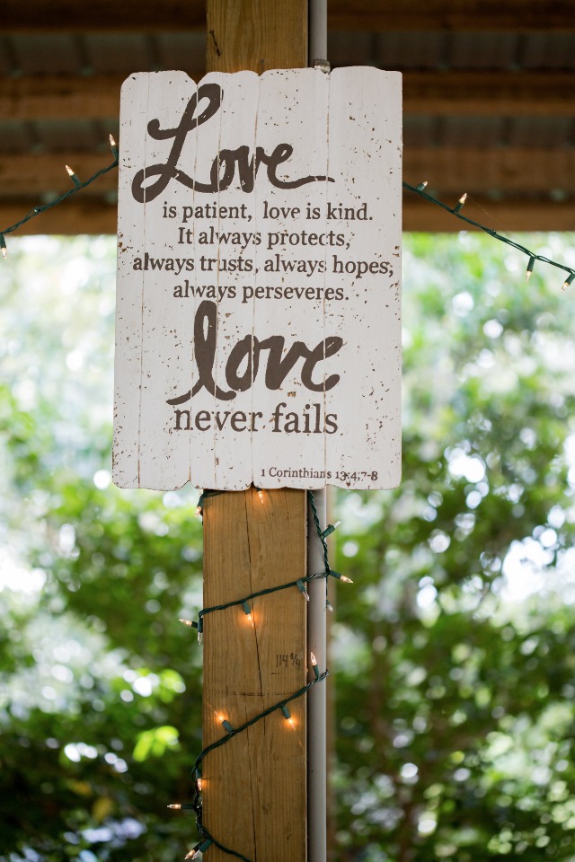 love never fails wedding quote sign