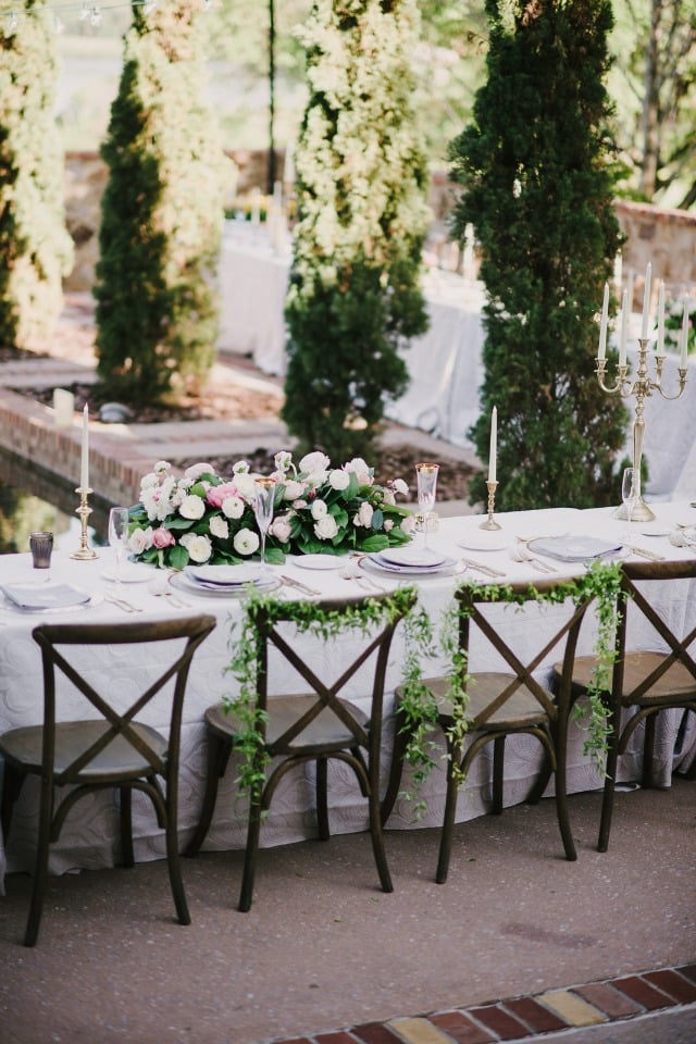 ivy draped bride and groom wedding seats