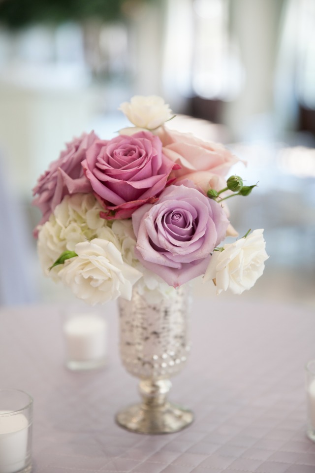 Roses and white flowers in a silver decorative vase