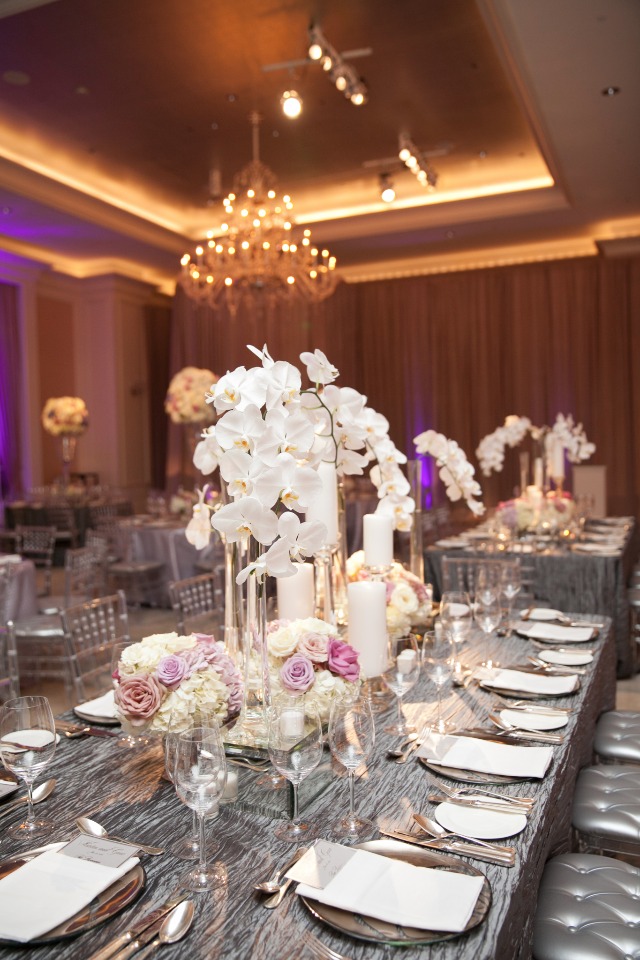 Elegant wedding reception table setting with orchids
