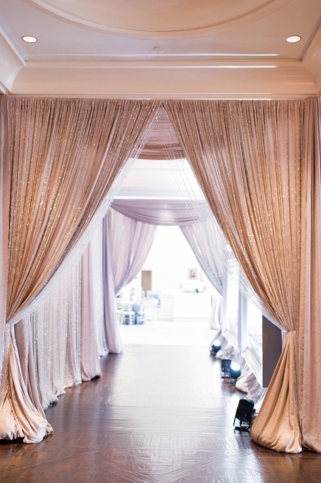 Elegant hallway draped with shimmering gold curtains