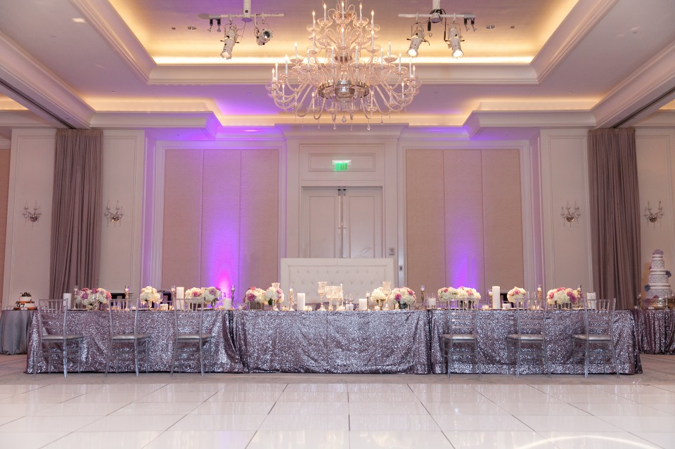 Elegant wedding reception table with purple lighting