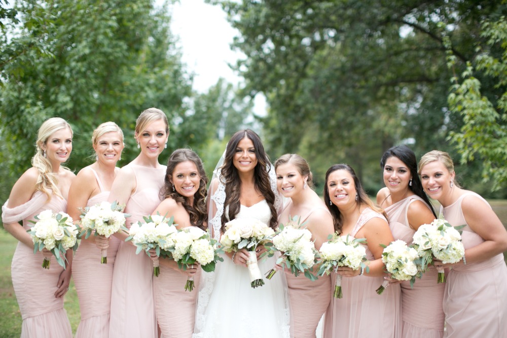 Bridesmaids in mix n match blush dresses