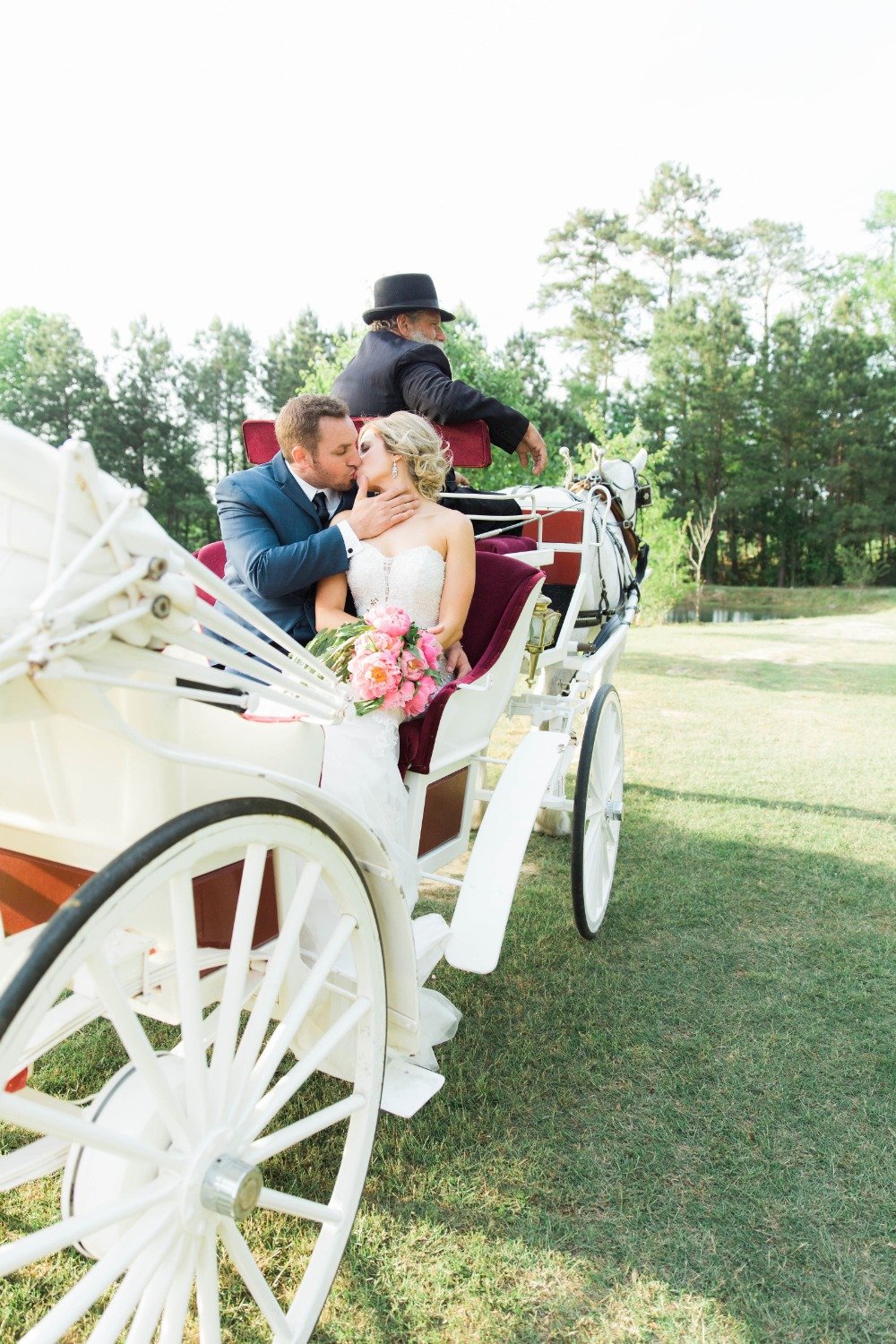 Wedding carriage kiss