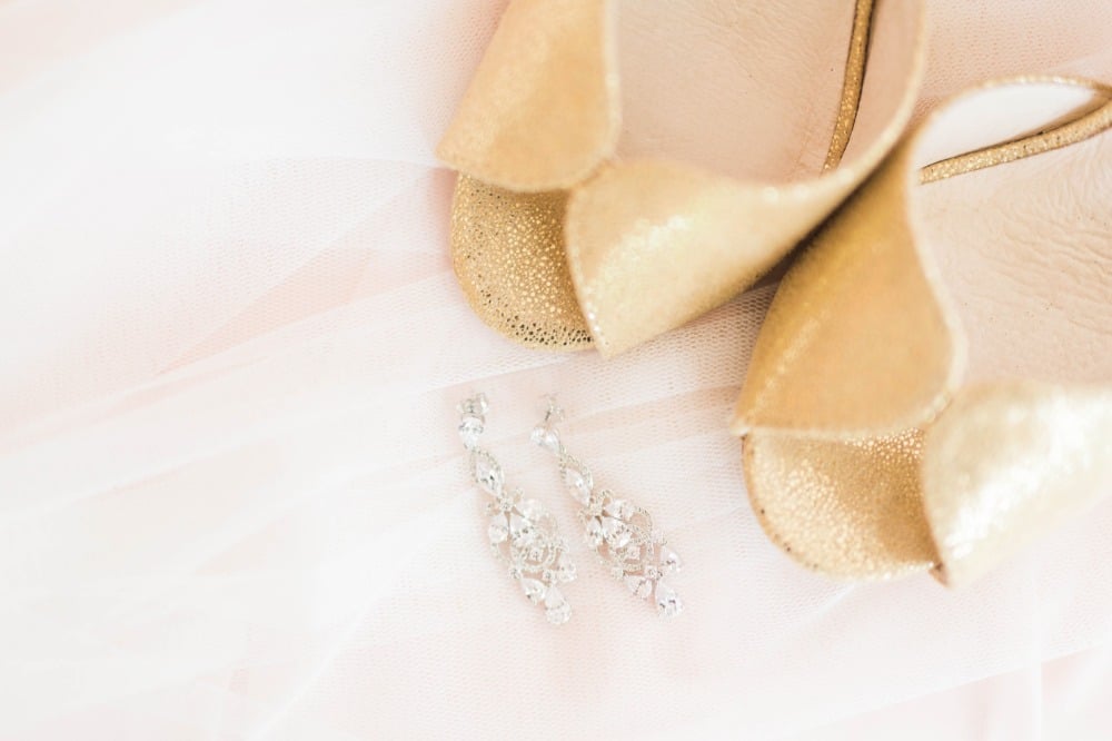 Gold heels and sparkly earrings