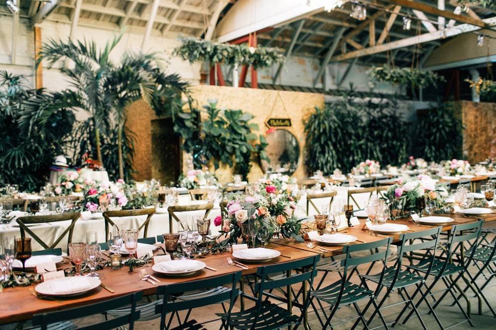 romantic wedding reception with tons of flowers