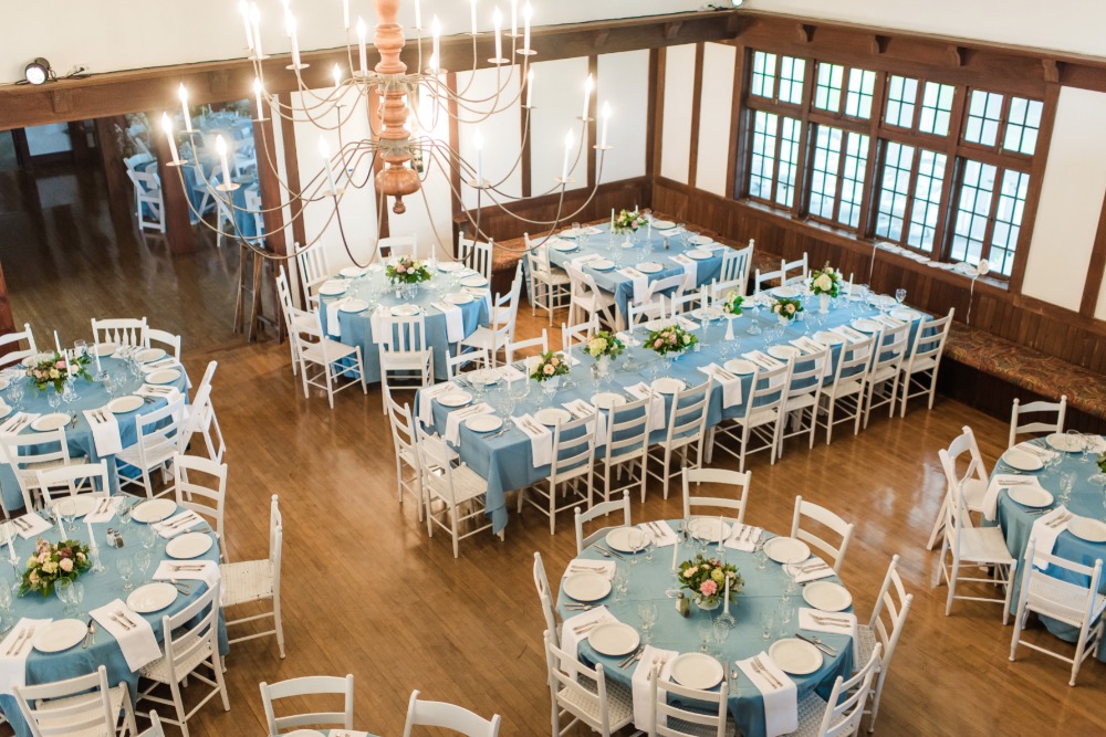 Elegant event dining room with blue white floral decor