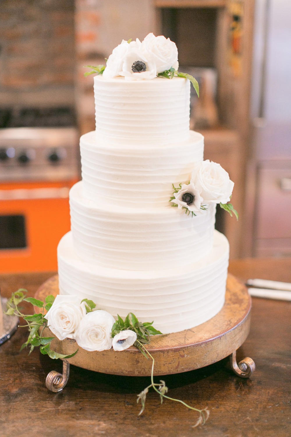 anemone topped wedding cake