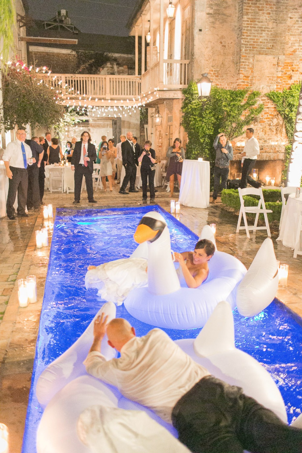 inflatable swan floats for an impromptu pool party