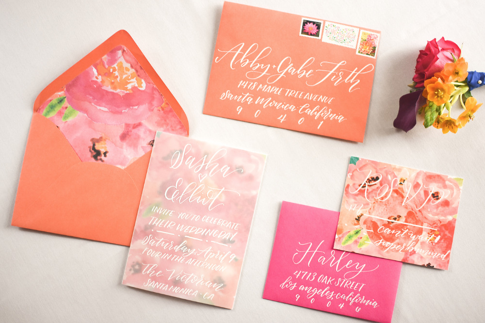 bright pink and orange wedding stationery