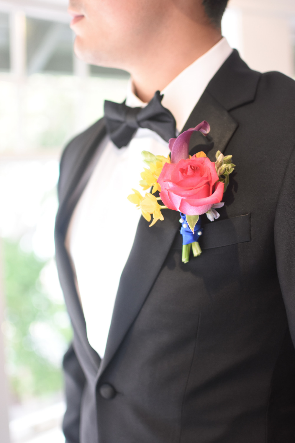pink and yellow floral boutonniere