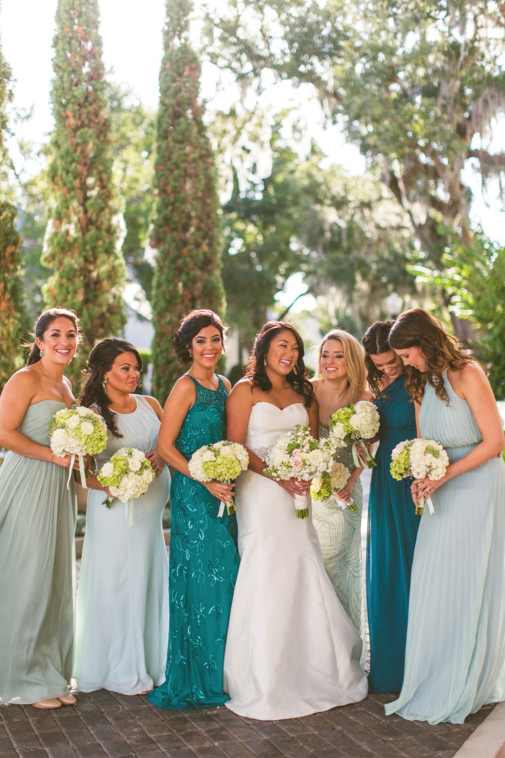 Bridesmaids in shades of teal
