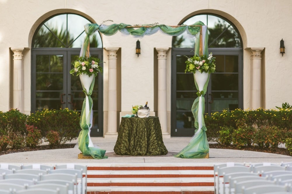 Teal and white wedding arbor