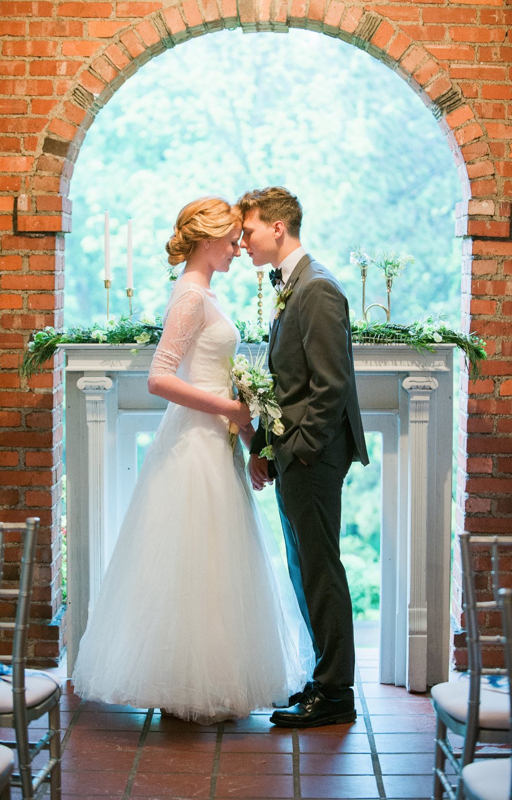 beautiful wedding ceremony with brick archway