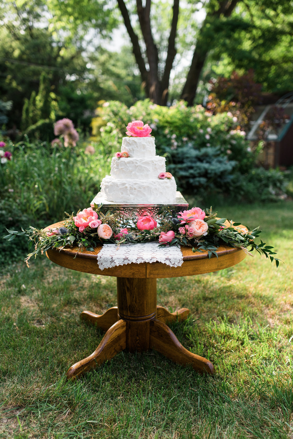 flower filled wedding cake table