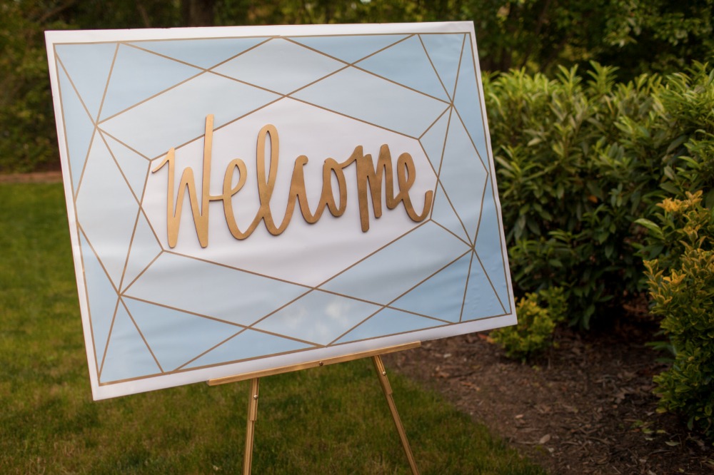 Geometric gold welcome sign