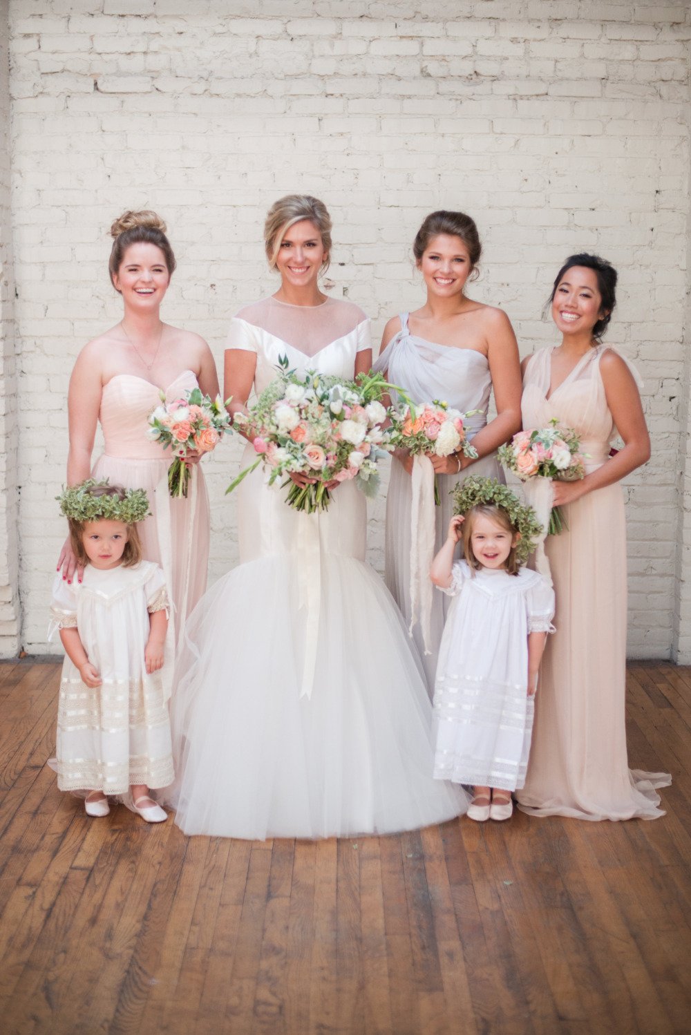 white and peach bridesmaids dress with flower girls